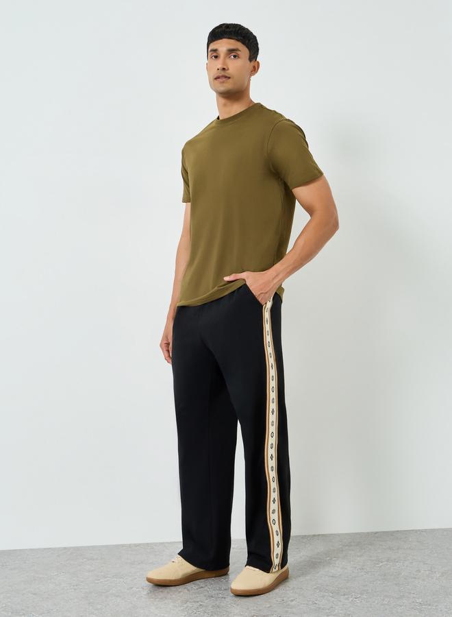 Styli Men Black Relaxed Joggers with Side Tape - Image 1